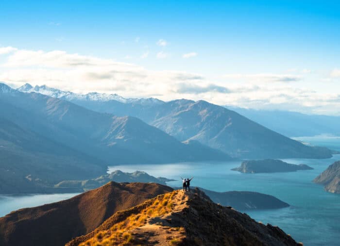 People enjoy with a beautiful landscape of the mountains and Lake Wanaka. Roys Peak Track, South Island, New Zealand.