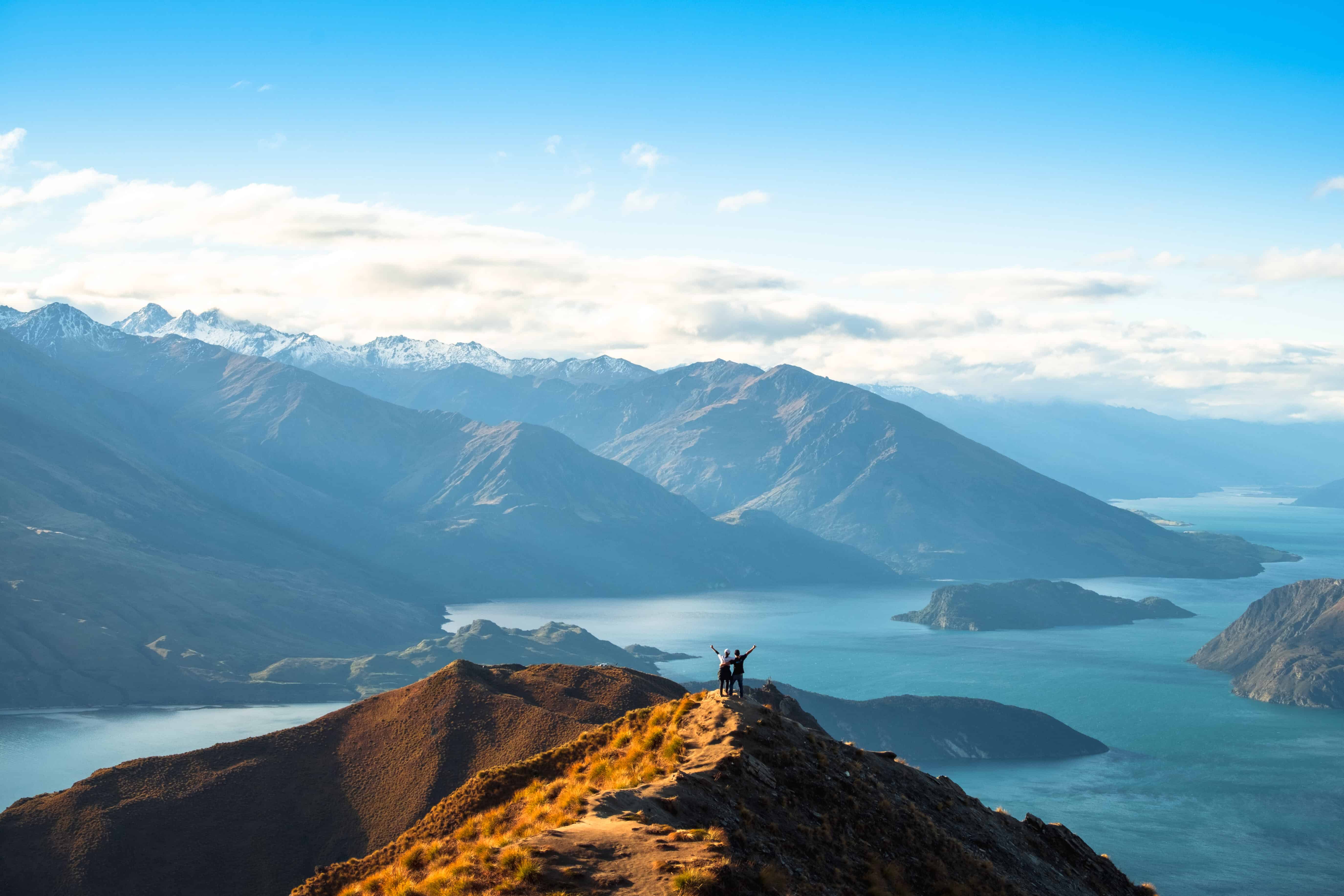 People enjoy with a beautiful landscape of the mountains and Lake Wanaka. Roys Peak Track, South Island, New Zealand.